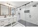 Stylish bathroom featuring double sinks, decorative mirrors and a glass enclosed shower at 3356 Thornewood Dr, Atlanta, GA 30340