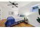 Comfortable bedroom with hardwood floors, ceiling fan, and side table at 3356 Thornewood Dr, Atlanta, GA 30340