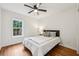 Bedroom with hardwood floors, a ceiling fan, and a view of the backyard from the window at 3356 Thornewood Dr, Atlanta, GA 30340