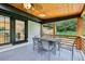 Comfortable covered patio with wood ceiling, ceiling fan and seating, perfect for relaxing or entertaining at 3356 Thornewood Dr, Atlanta, GA 30340