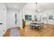 Bright dining room with vaulted ceilings, modern lighting fixture, and adjacent to the kitchen at 3356 Thornewood Dr, Atlanta, GA 30340