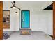 Inviting front porch with teal door, modern lighting and wood accents at 3356 Thornewood Dr, Atlanta, GA 30340