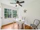 Bright home office featuring natural light, ceiling fan, and hardwood floors at 3356 Thornewood Dr, Atlanta, GA 30340