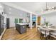 Open-concept kitchen and dining area featuring a large island and modern chandelier at 3356 Thornewood Dr, Atlanta, GA 30340