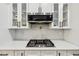 Close up of stainless steel appliances and modern backsplash in updated kitchen at 3356 Thornewood Dr, Atlanta, GA 30340
