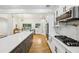 Bright, open kitchen with stainless appliances, gas range, large island and bar seating at 3356 Thornewood Dr, Atlanta, GA 30340