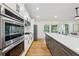 Bright kitchen with stainless steel appliances, white cabinetry, and a large center island at 3356 Thornewood Dr, Atlanta, GA 30340