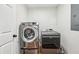 Laundry room featuring modern, front-load washer and dryer units at 3356 Thornewood Dr, Atlanta, GA 30340