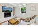 Cozy living area featuring a fireplace, a view from the window and comfortable seating at 3356 Thornewood Dr, Atlanta, GA 30340