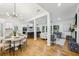 Open concept living and dining area with modern lighting, hardwood floors, and neutral decor at 3356 Thornewood Dr, Atlanta, GA 30340