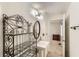 Small bathroom featuring a vanity with an ornate shelf next to it at 4470 Hopkins Lake Nw Dr, Duluth, GA 30096