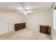 Neutral bedroom featuring carpeted flooring and a ceiling fan at 4470 Hopkins Lake Nw Dr, Duluth, GA 30096