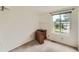 Simple bedroom featuring carpeted floors and a window at 4470 Hopkins Lake Nw Dr, Duluth, GA 30096