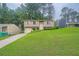 A two-story home has a well-manicured lawn at 4470 Hopkins Lake Nw Dr, Duluth, GA 30096