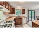Functional kitchen featuring wood cabinets and a view of the outdoor deck at 4470 Hopkins Lake Nw Dr, Duluth, GA 30096