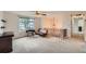Cozy upstairs loft space with neutral carpet, window view, and vintage sewing machine at 4470 Hopkins Lake Nw Dr, Duluth, GA 30096