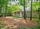 The backyard features mature trees and shrubbery, creating a private oasis at 773 N Superior Ave, Decatur, GA 30033