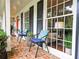 Inviting brick front porch with comfortable seating, stylish decor, and classic black shutters enhancing curb appeal at 773 N Superior Ave, Decatur, GA 30033