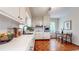 Bright kitchen featuring white cabinetry, stainless steel appliances, and eat-in area at 773 N Superior Ave, Decatur, GA 30033