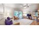 Bright living room with hardwood floors, ceiling fan, and sliding glass doors leading to sunroom at 773 N Superior Ave, Decatur, GA 30033