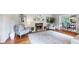 Cozy living room with hardwood floors, a decorative fireplace, and elegant furniture creating a welcoming atmosphere at 773 N Superior Ave, Decatur, GA 30033