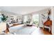Bright living room featuring hardwood floors, neutral furniture, and large windows providing ample natural light at 773 N Superior Ave, Decatur, GA 30033