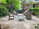Comfortable patio area with cozy wicker furniture and serene, shaded surroundings at 773 N Superior Ave, Decatur, GA 30033