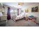 Bright bedroom featuring a ceiling fan, closet, and a colorful bed at 1164 Baylor Nw St, Atlanta, GA 30318