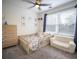 Bedroom with carpet, neutral walls, a ceiling fan, and a toddler bed and sofa at 1164 Baylor Nw St, Atlanta, GA 30318