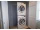 Functional laundry room with stacked washer and dryer units for added convenience at 1164 Baylor Nw St, Atlanta, GA 30318