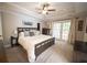 Spacious main bedroom with tray ceilings, carpet, and French doors to the outside patio at 1164 Baylor Nw St, Atlanta, GA 30318