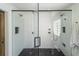 Spacious shower with a glass door and dual shower heads, black trim and fixtures at 1164 Baylor Nw St, Atlanta, GA 30318