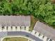 This is an aerial view of a home with a driveway and landscaping at 153 Witter Way, Woodstock, GA 30188