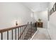 Hallway featuring wood railing and a plant at 153 Witter Way, Woodstock, GA 30188