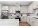 Modern kitchen featuring stainless steel appliances, white cabinetry, and a center island at 153 Witter Way, Woodstock, GA 30188