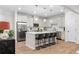 Modern kitchen with stainless steel appliances, island with seating, and white cabinetry at 153 Witter Way, Woodstock, GA 30188