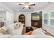 Bright living room featuring a fireplace, built in shelves, and comfortable sofa at 153 Witter Way, Woodstock, GA 30188