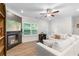 Cozy living room featuring a fireplace, recessed lighting, and large windows offering natural light at 153 Witter Way, Woodstock, GA 30188