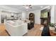 Open-concept living room showcases a fireplace, hardwood floors, and seamless flow to the kitchen at 153 Witter Way, Woodstock, GA 30188