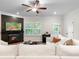Inviting living room features a cozy fireplace, recessed lighting, and a comfortable white sofa at 153 Witter Way, Woodstock, GA 30188