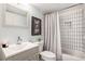 Bathroom featuring shower-tub combo and modern vanity at 2022 Ramblewood Ne Ct, Marietta, GA 30062