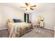 Cozy bedroom features a ceiling fan and matching dresser and vanity set at 2022 Ramblewood Ne Ct, Marietta, GA 30062