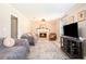 Cozy living room with a fireplace and warm, neutral tones at 2022 Ramblewood Ne Ct, Marietta, GA 30062
