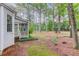 View of the backyard with a screened porch connected to the house at 2088 Blackberry Ln, Auburn, GA 30011