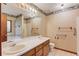 Bathroom with double sinks, large vanity, and separate shower at 2088 Blackberry Ln, Auburn, GA 30011