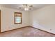 Carpeted bedroom featuring a ceiling fan and a window with wood trim at 2088 Blackberry Ln, Auburn, GA 30011