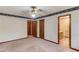 Bedroom featuring ensuite bathroom and wood trim at 2088 Blackberry Ln, Auburn, GA 30011