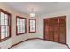 Bright dining room with three windows, closet, and traditional light fixture at 2088 Blackberry Ln, Auburn, GA 30011