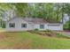 Exterior of a one-story home with green shutters, showing a well-maintained lawn and an attached garage at 2088 Blackberry Ln, Auburn, GA 30011