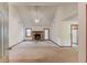 Bright, spacious living room with a stone fireplace and a high ceiling, offering a comfortable and inviting atmosphere at 2088 Blackberry Ln, Auburn, GA 30011